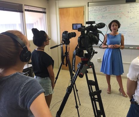Communication interns conduct a video interview.