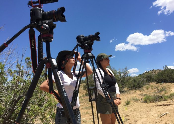 InternsFieldSchool Two videographers use their cameras during a video production.
