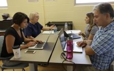 Team works at desk together